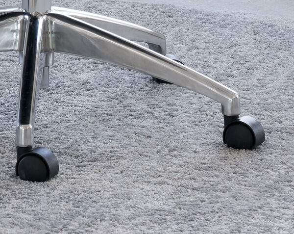 closeup of polished aluminum base and casters 