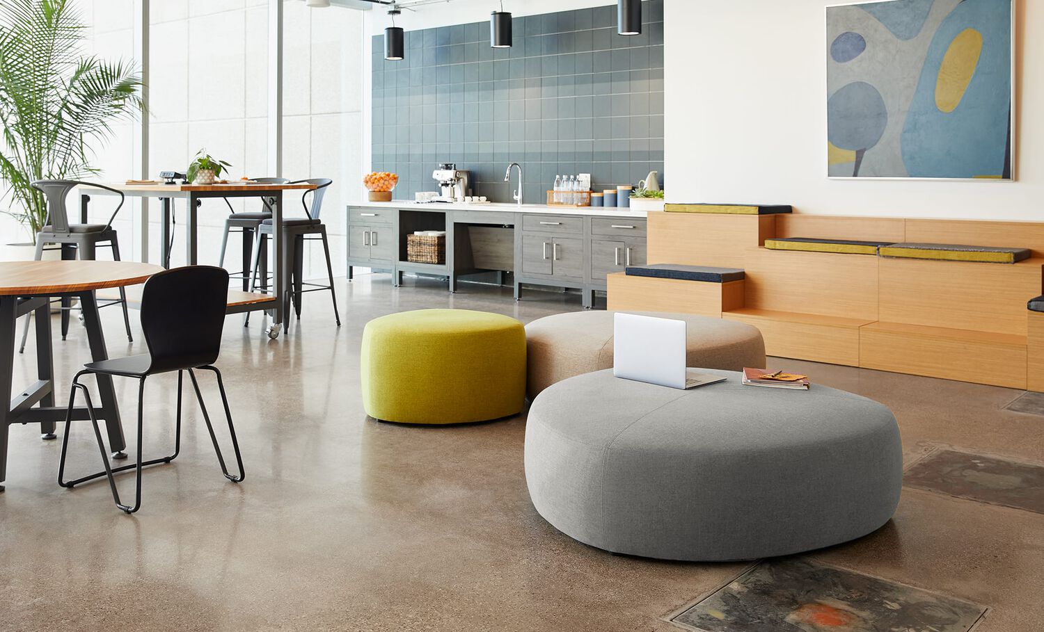 large and small ottoman in  lounge setting with other vari products 