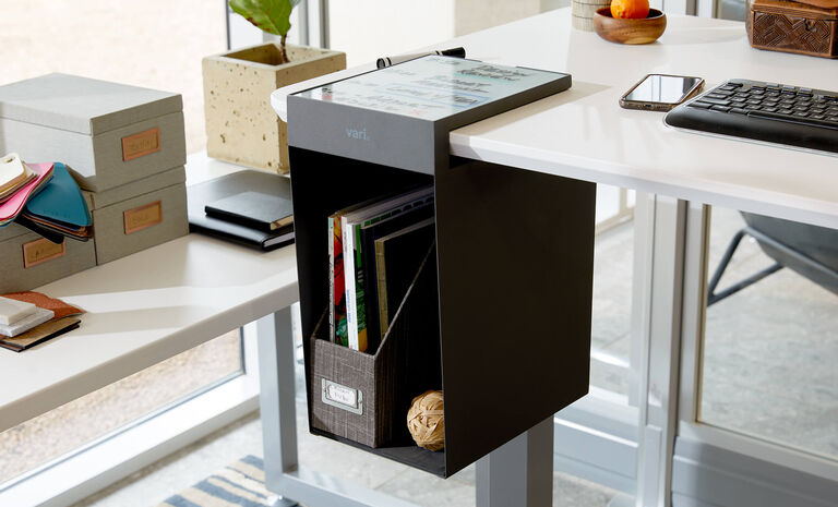 Vari hanging desk cubby mounted on electric standing desk 