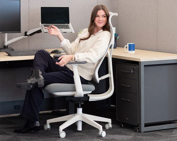 view of a woman enjoying an office chair