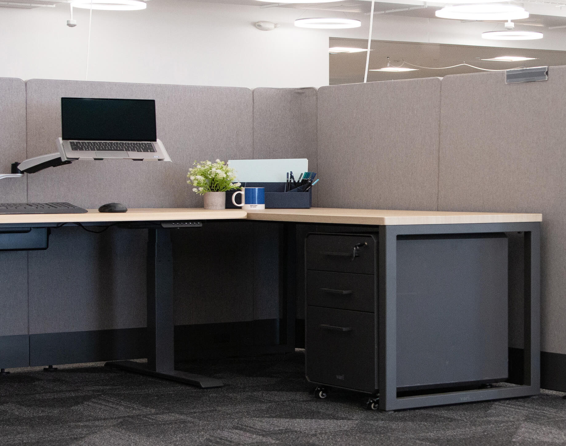 professional sitting on couch with cup of coffee on an accent table