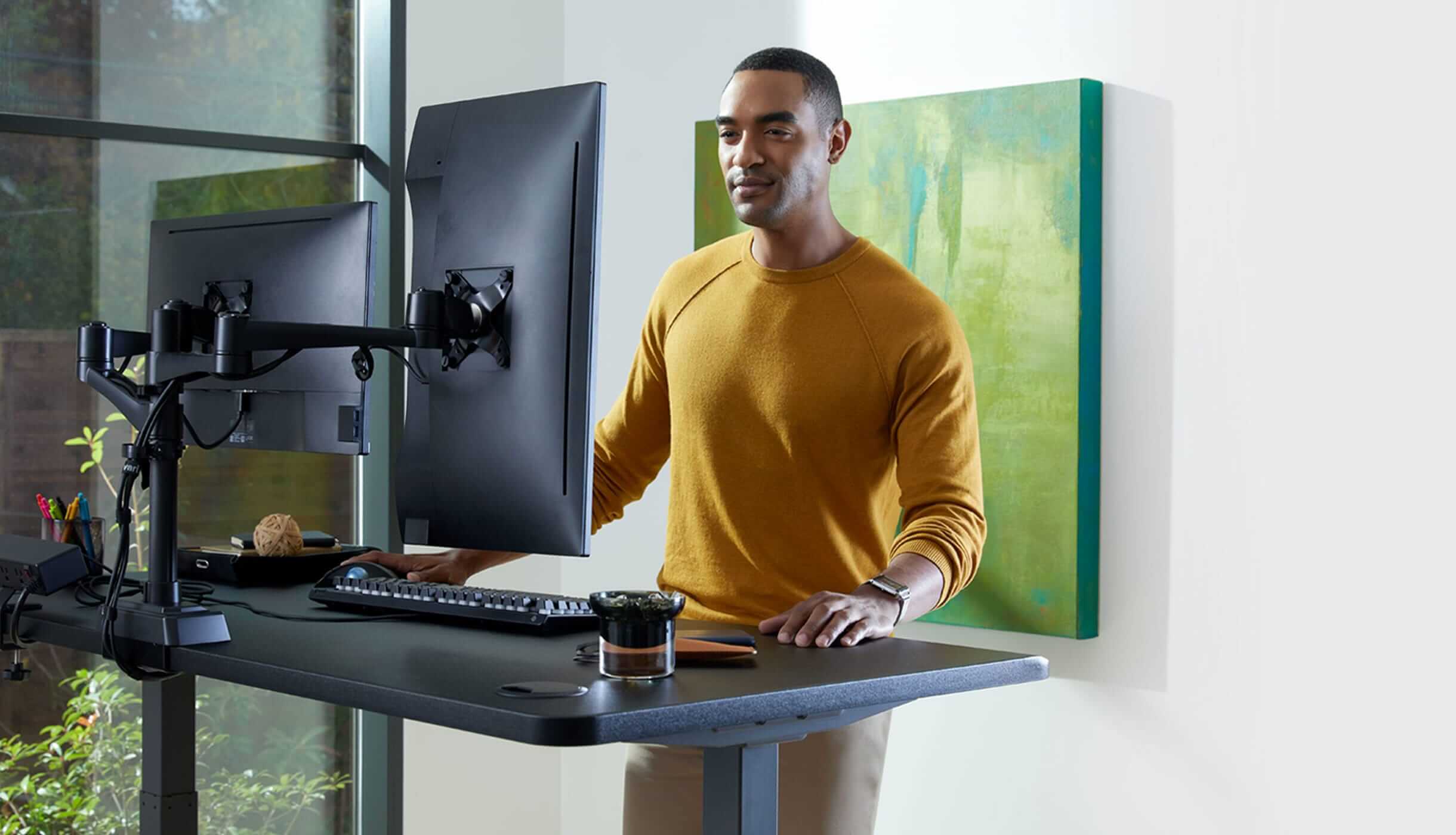electric standing desk and dual monitor arms