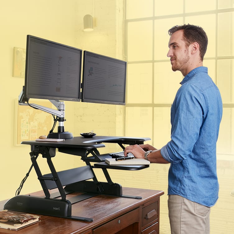 individual standing at a converter working