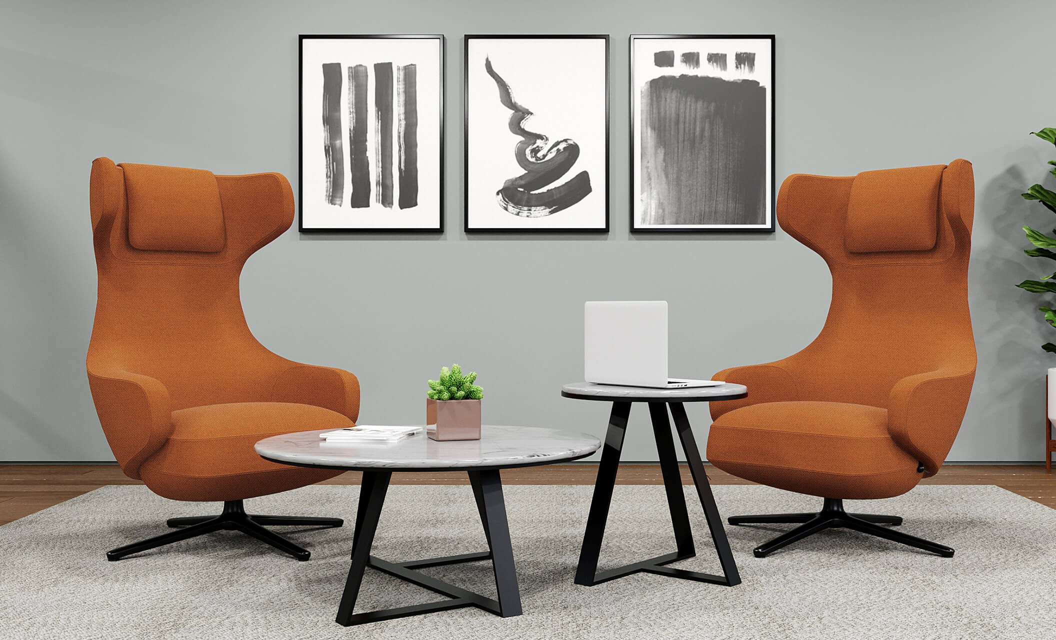 two high back lounge chairs in burnt orange arranged in an office with the large nesting table and small nesting table
