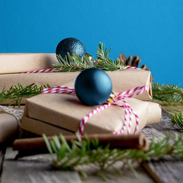 wrapped gifts and holiday decor on table