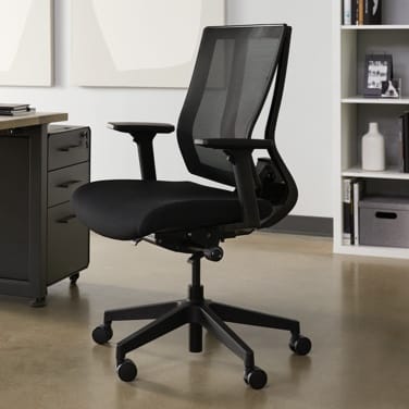 vari task chair in office setting next to table