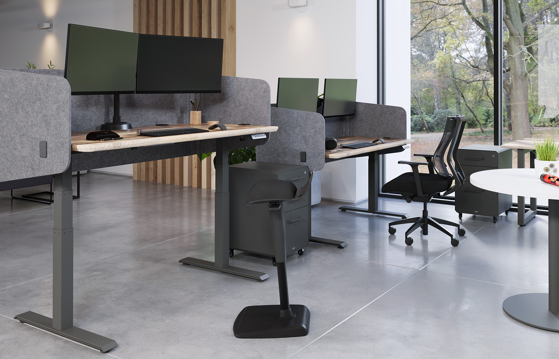 adjustable monitor arms hold computers high enough so that an office professional can comfortably use the computer