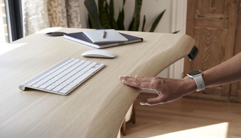 professionals standing in her home office working