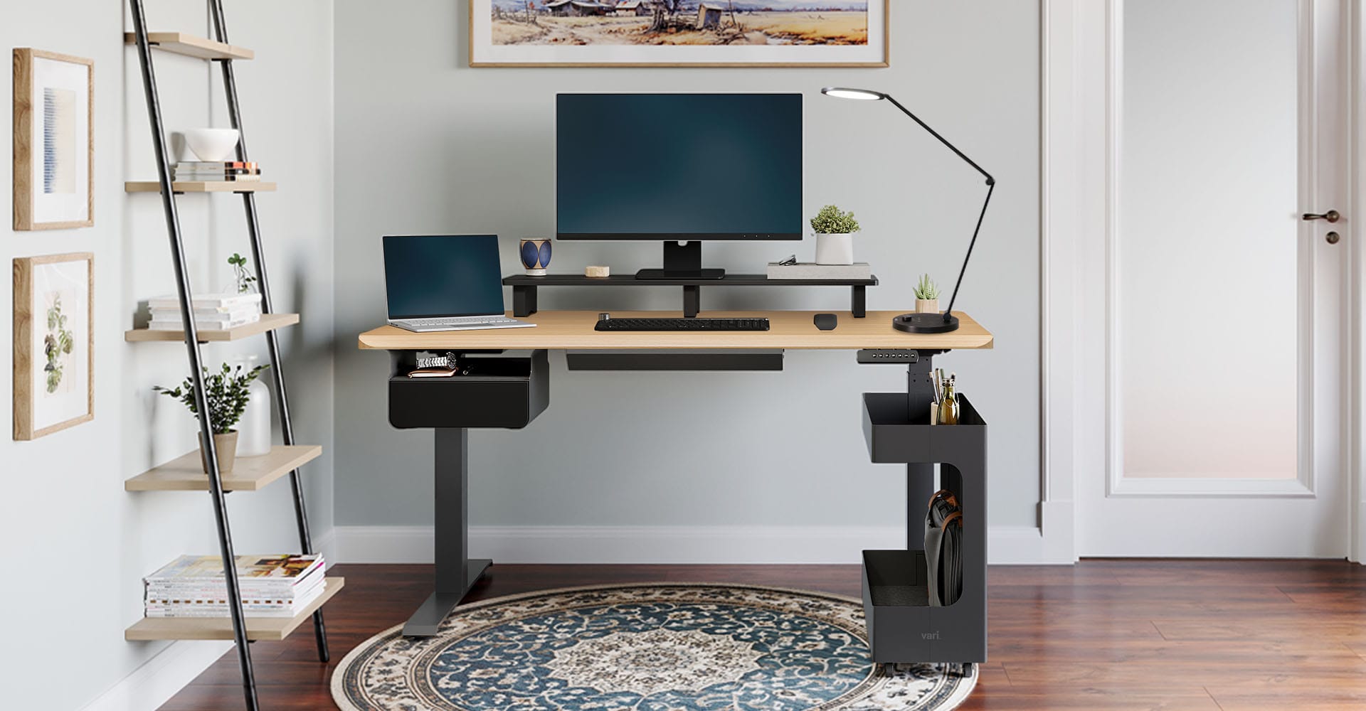 home office setup with an electric standing desk and accessories