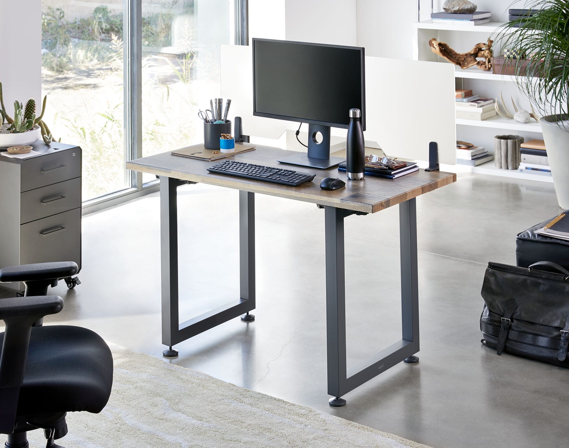 vari table 48 by 24 in reclaimed wood shown in office setting