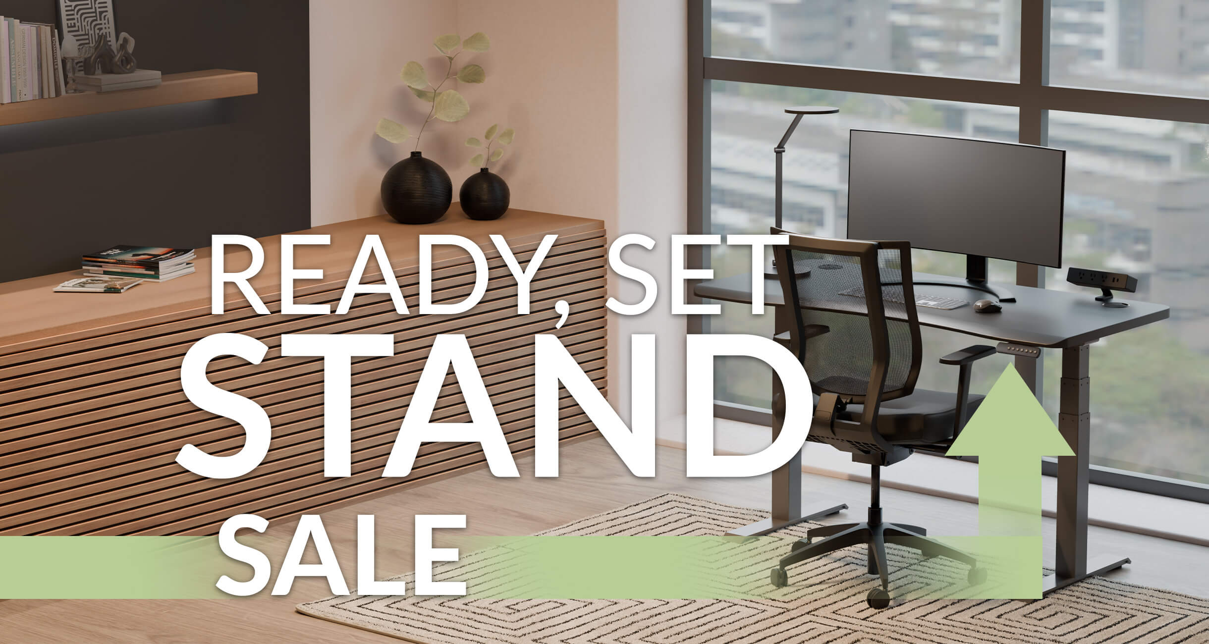 an electric standing desk and a office chair in a workspace