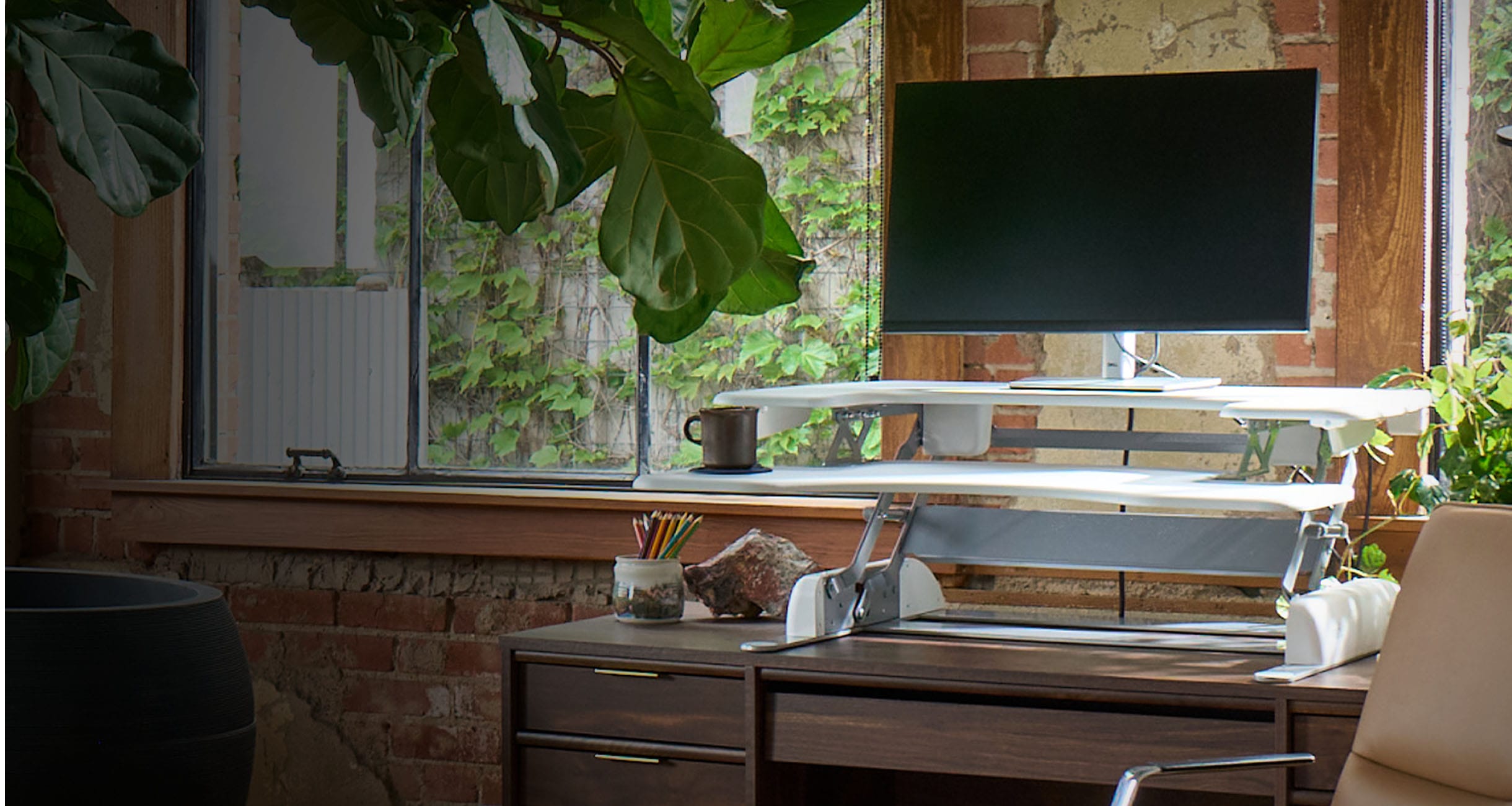 invidual standing and working in an office setting
