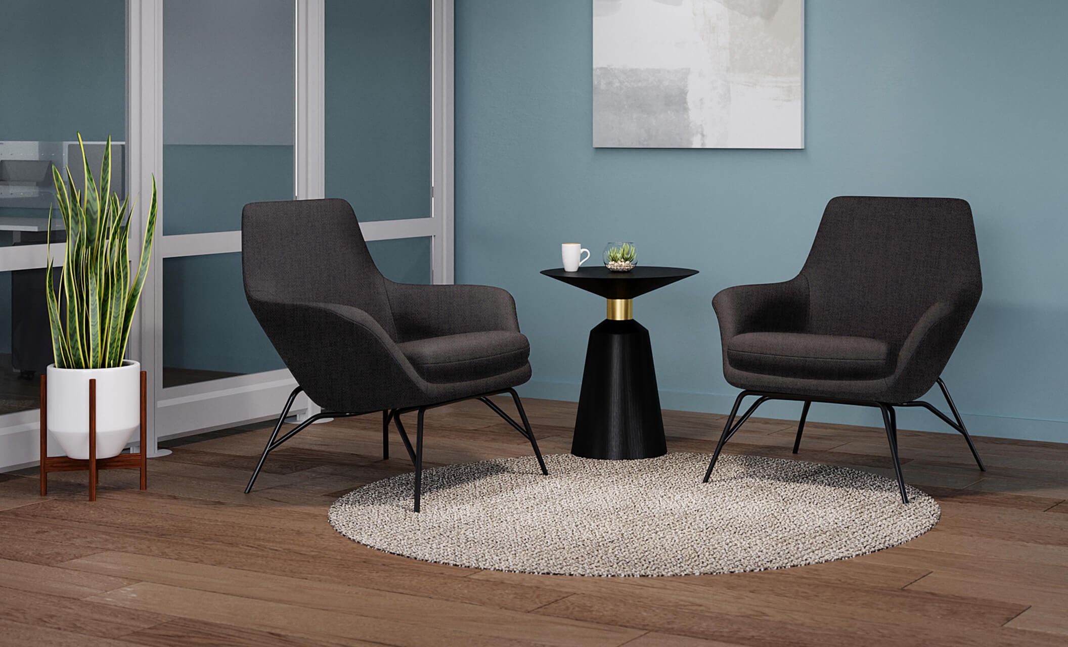 two arm chairs are positioned around the pedestal side table