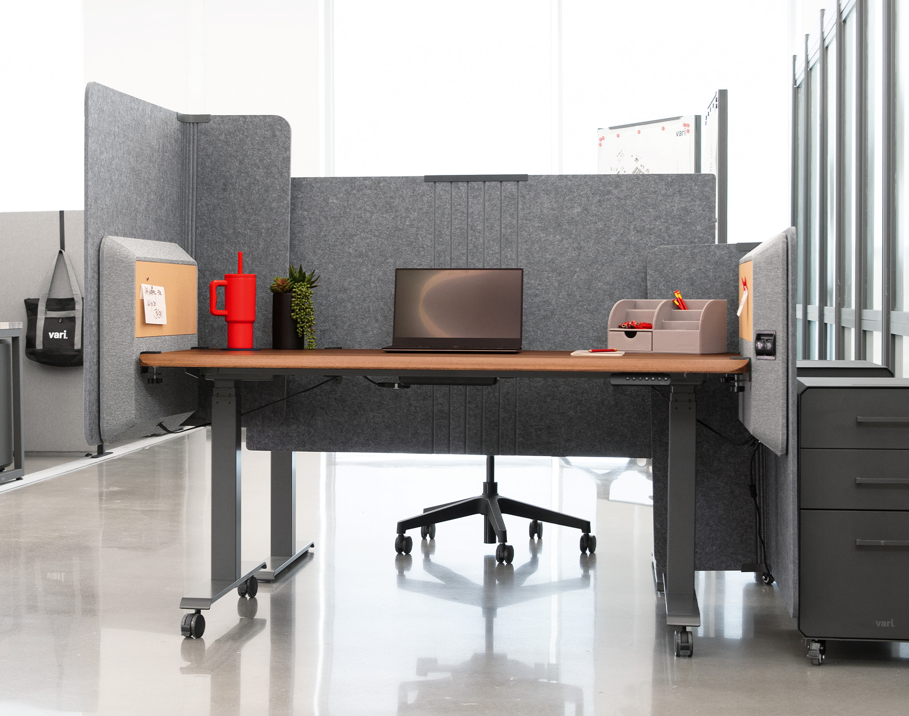 adjustable monitor arms hold computers high enough so that an office professional can comfortably use the computer